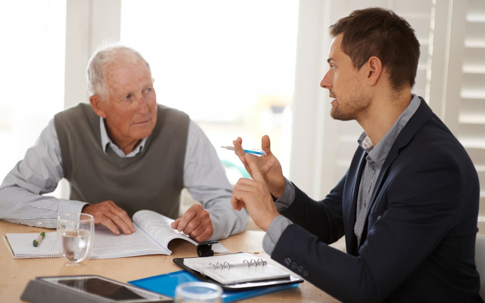 Senior man speaking with his financial advisor about wills and trusts