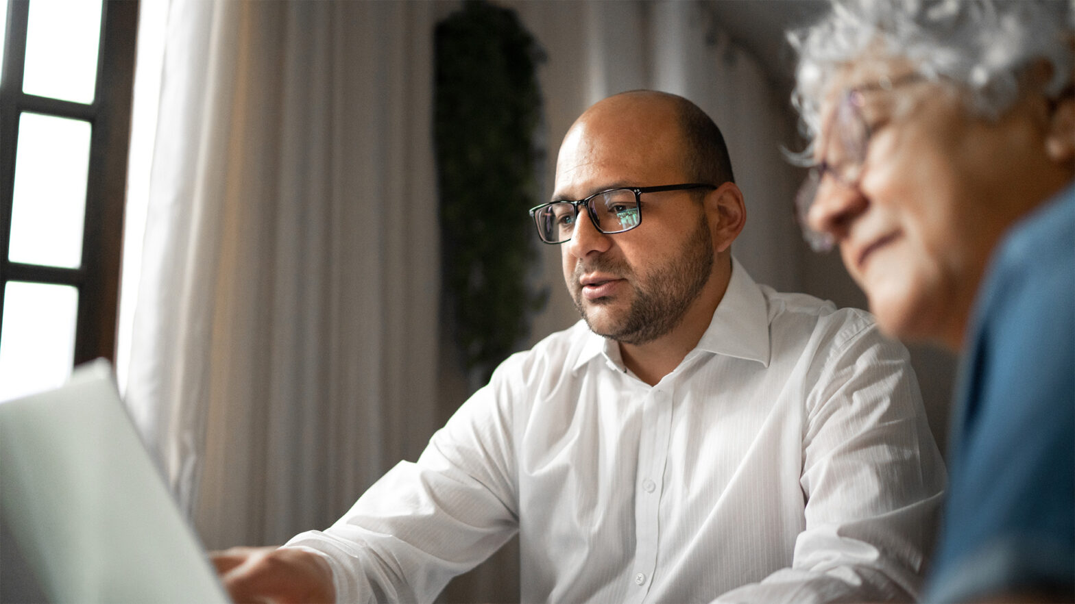Senior review insurance options with an advisor