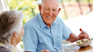 Senior man enjoying lunch outside