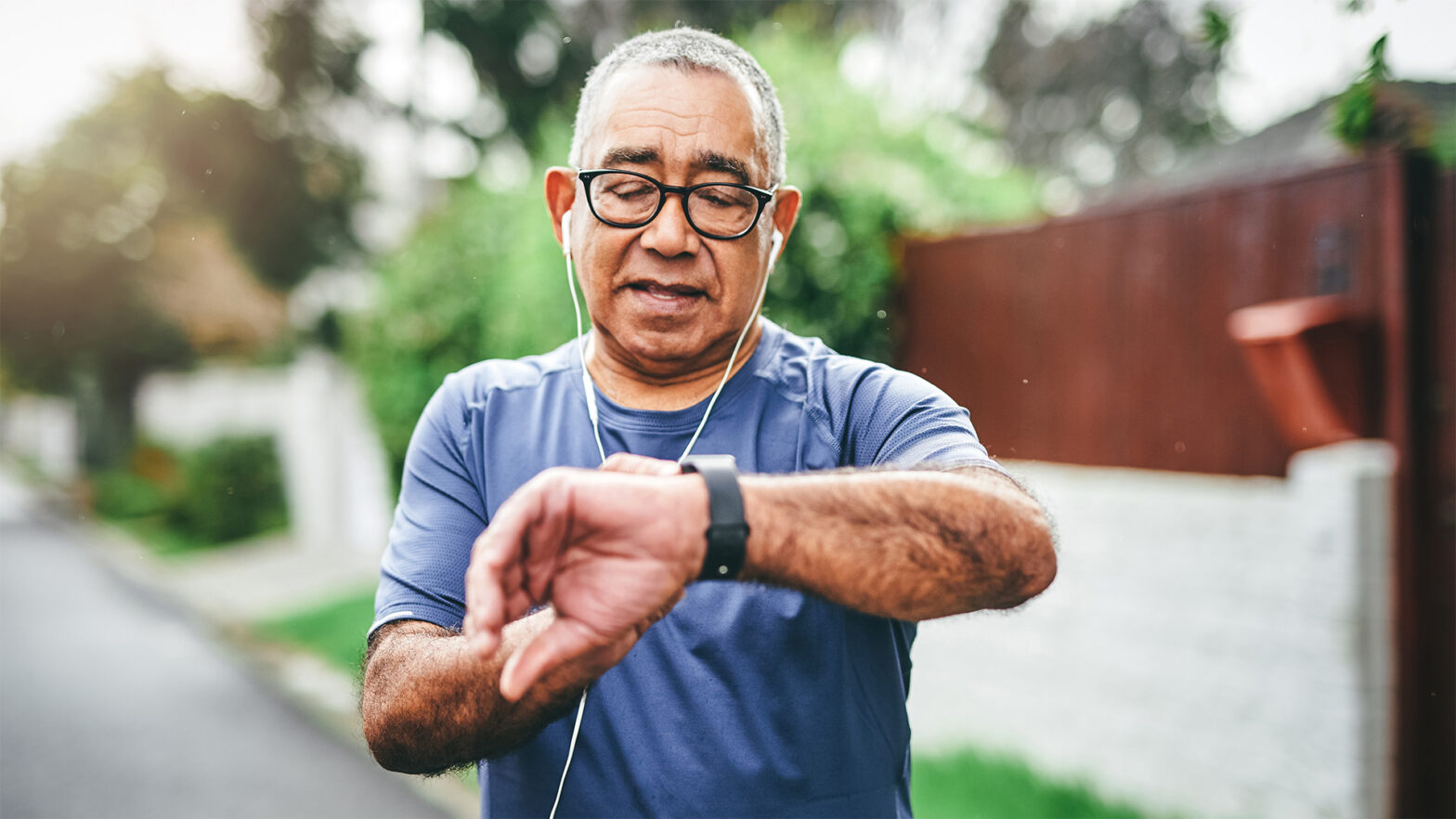 Older man check watch while talking a walk