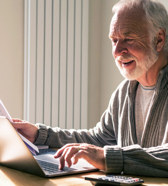 Older man using laptop
