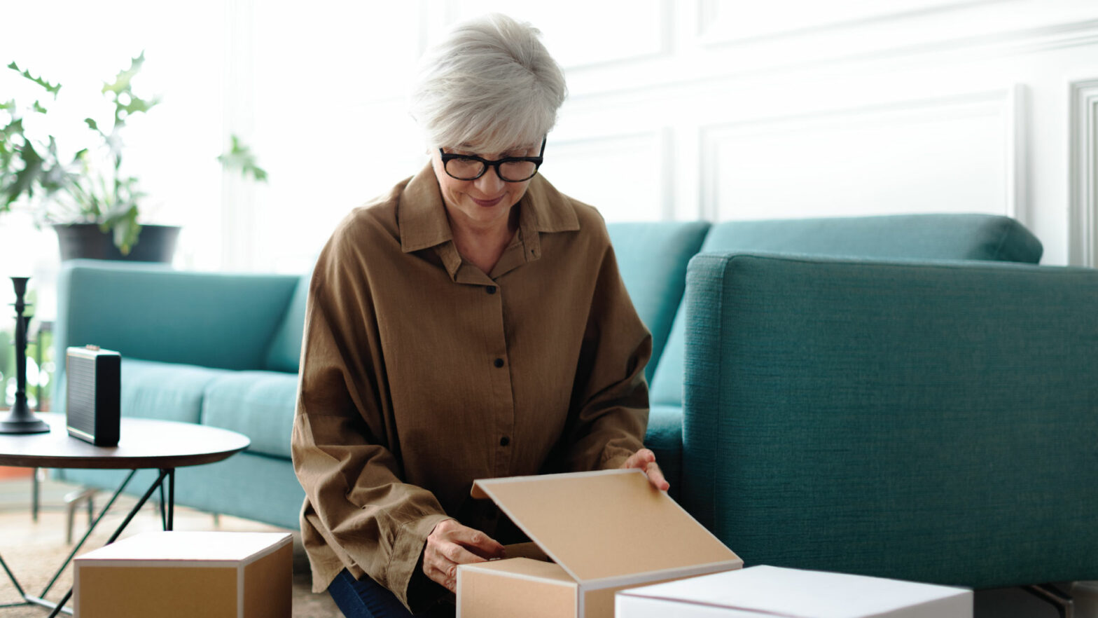 Senior Woman boxing up things in her home