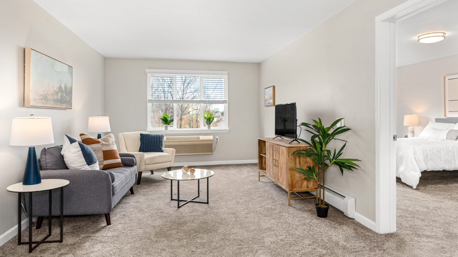 Living room at a Holiday by Atria senior living apartment