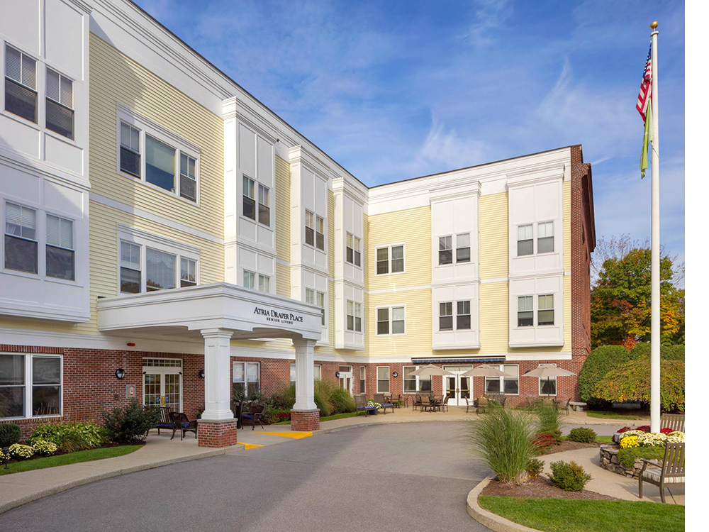 Exterior entrance to Atria Draper Place Senior Living in Hopedale, MA